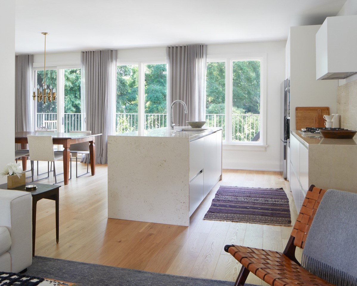 Kitchen with Three Sets of White Windows