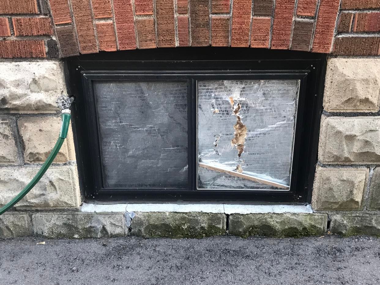 An old window containing building, ground, outdoor, brick